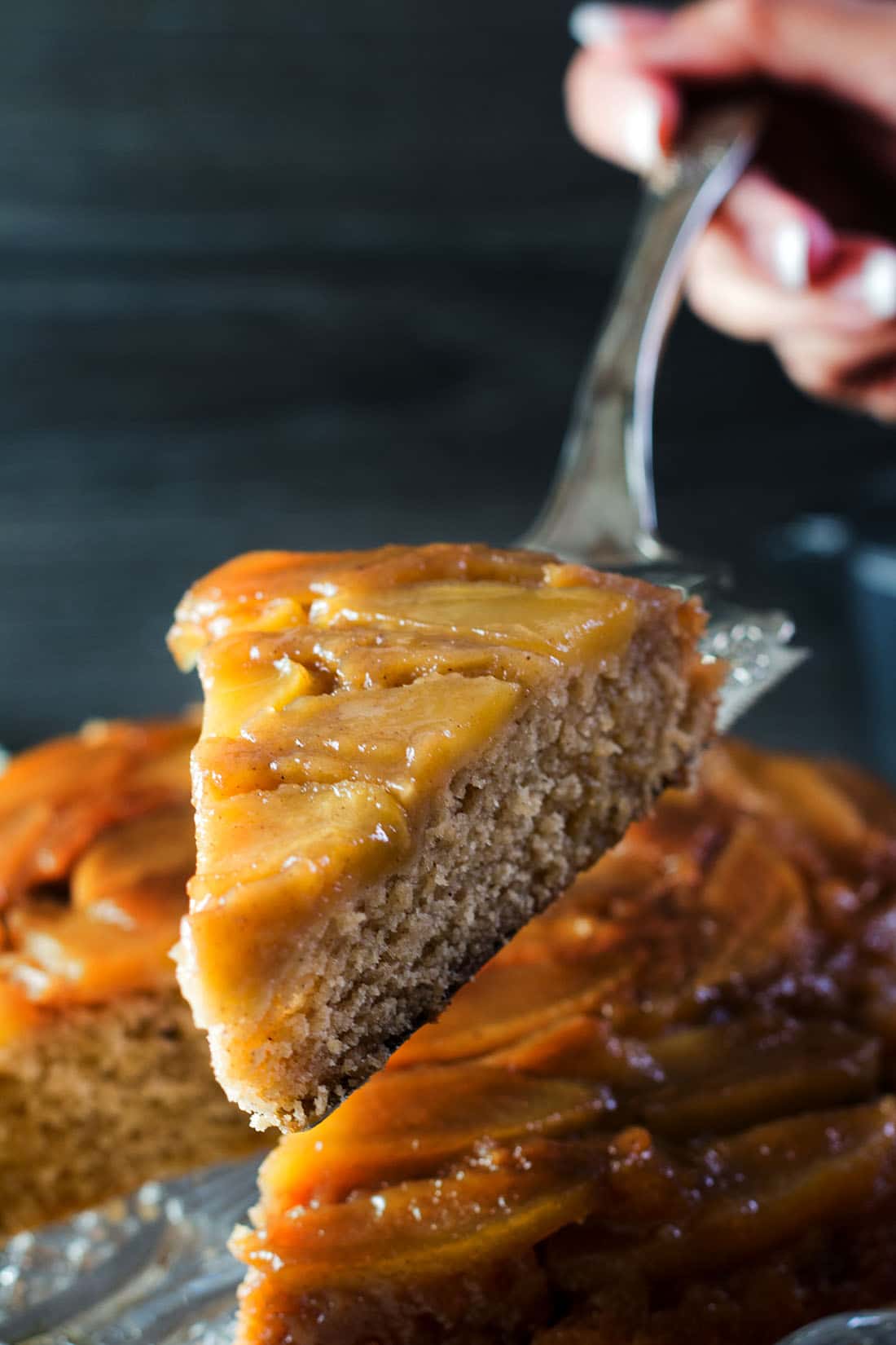 A beautiful slice of the upside down cake on a cake slice.