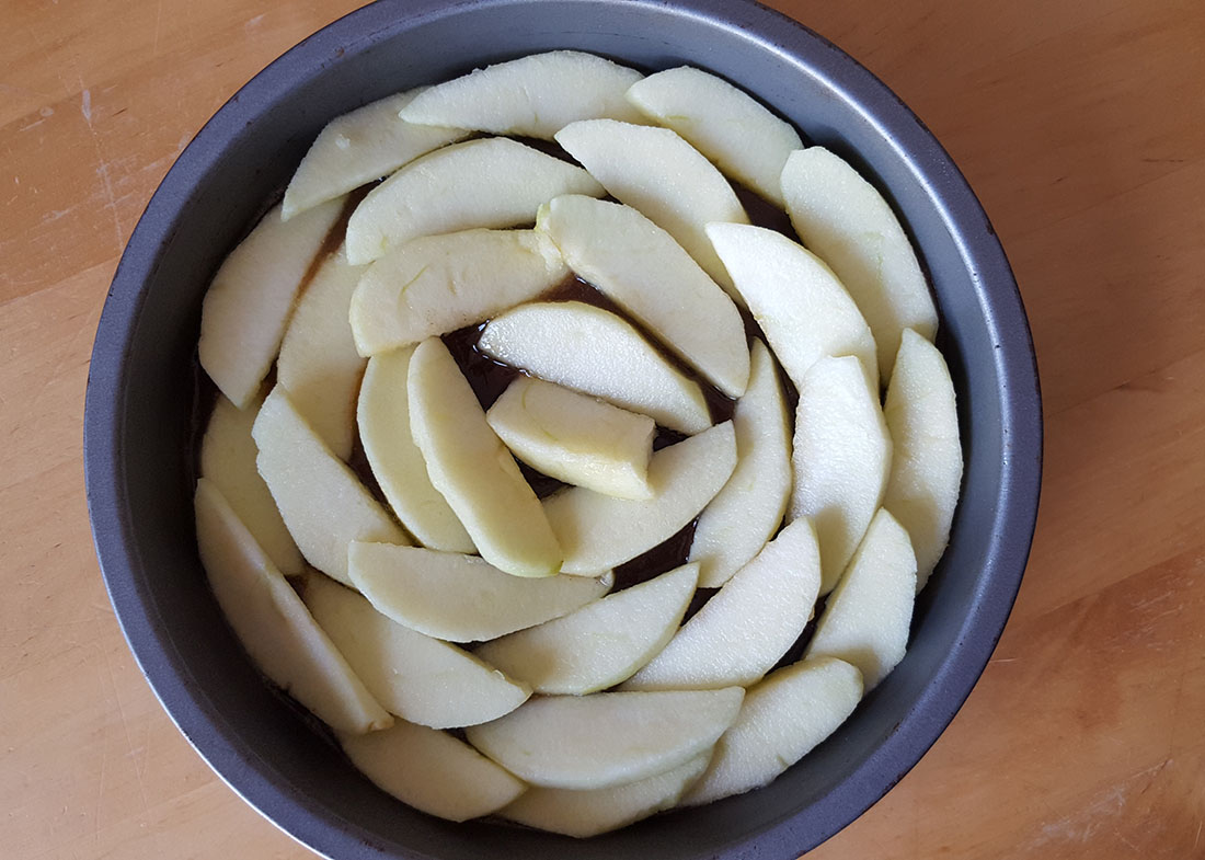 Sliced apples arranged in a pan