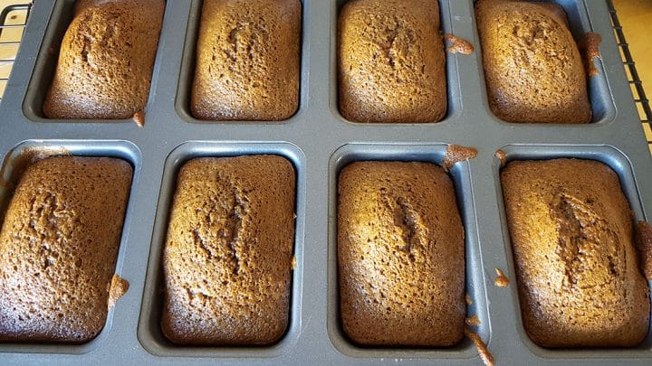 The freshly baked, golden brown cakes still in the pan