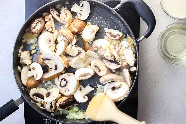 Mushrooms added to the pan with the garlic and onions