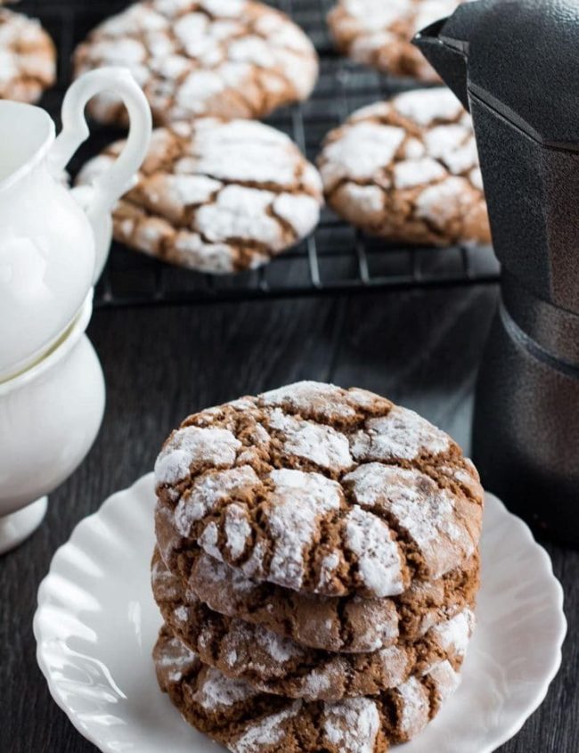 This recipe for Spiced Ginger Crinkle Cookies are ideal for holiday baking. These gingerbread flavored crinkle cookies are full of flavor, chewy, and coated in sugar to reveal their crinkle cookie cracks.