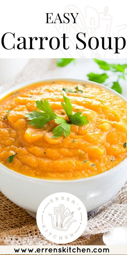 carrot soup in a bowl topped with fresh corriander leaves