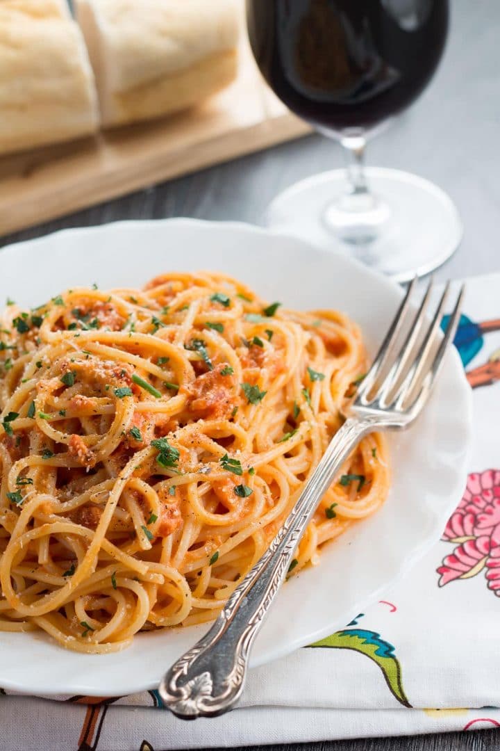 Spaghetti with Skinny Tomato Cream Sauce served on a dish with a fork next to it