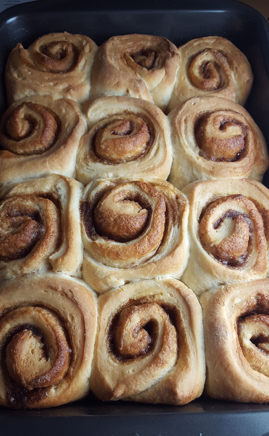 Golden brown Freshly baked vanilla bean cinnamon buns 