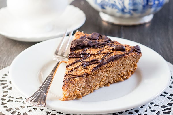 a slice of peanut butter oat bar on a plate with a fork