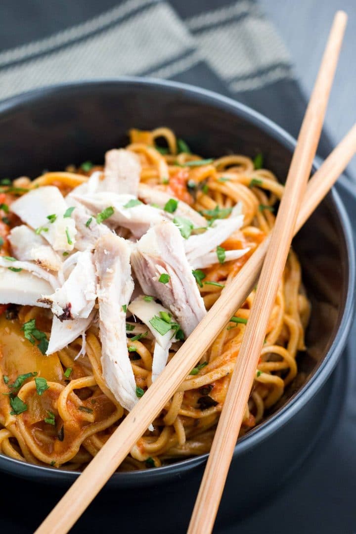 close up of a bowl of Thai Curry noodles with chopsticks