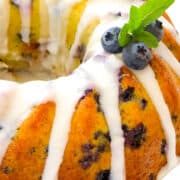 a Blueberry Bundt Cake topped with icing and blueberries