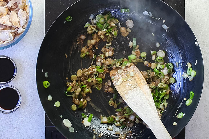 onions, green onions and garlic cooking with anchovy paste