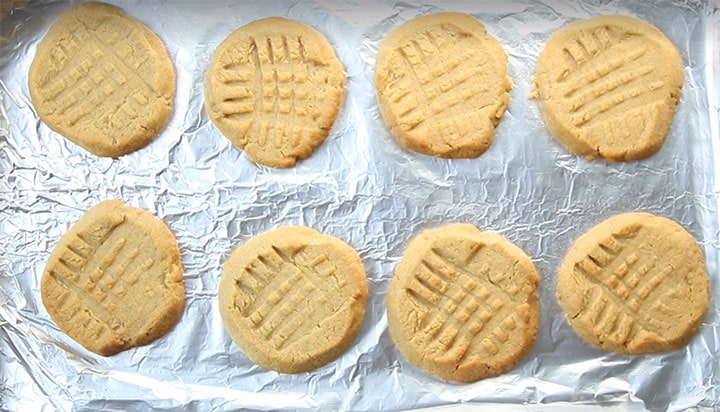 fresh baked Classic Peanut Butter Cookies with golden edges and crisscross pattern