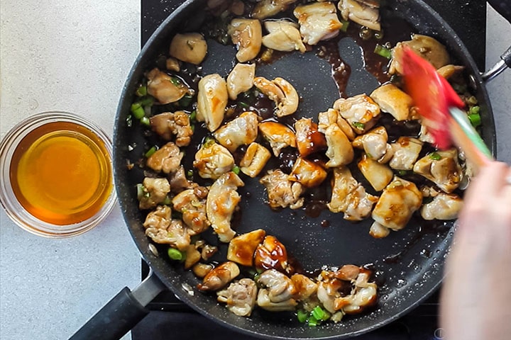  Hoisin sauce added to the pan with the chicken, garlic, ginger and green onions