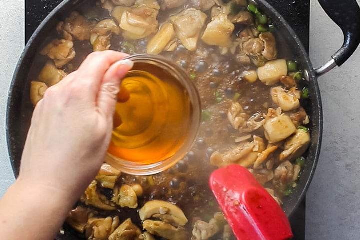 Honey being added to the Chinese Chicken and Broccoli in the pan