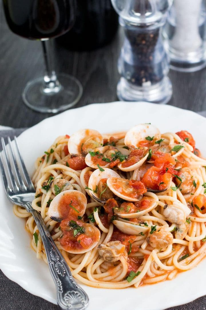 A dish piled with the freshly cooked Spaghetti with Red Clam Sauce