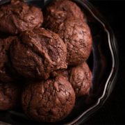 A close up of a Chocolate hazelnut cookies piled on a silver platter