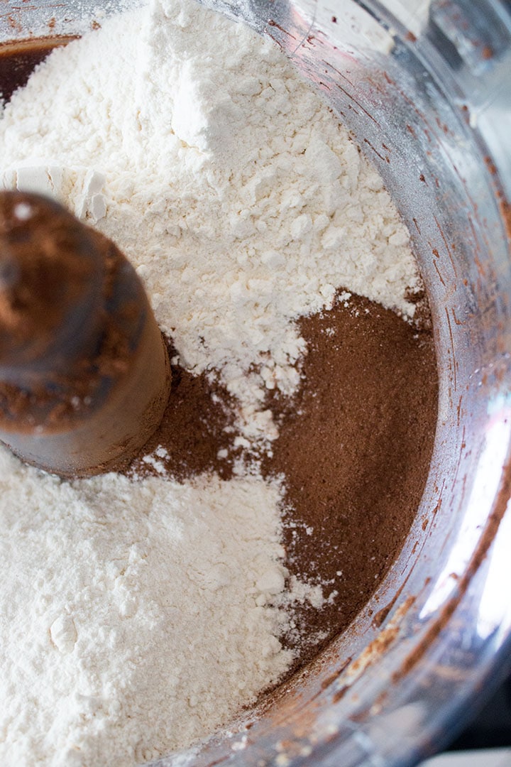 Flour and cocoa powder added to the bowl ready to mix together