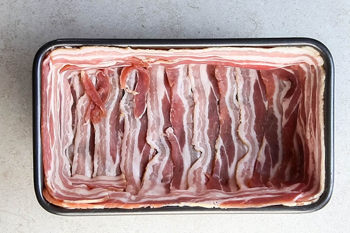 Bacon strips lining a loaf pan