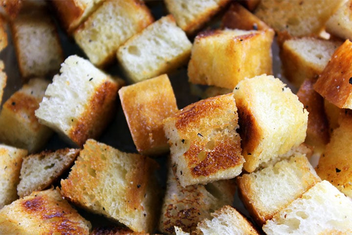 a close up of bread cubes for stuffing