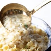 cauliflower pasta sauce ladled from a pan