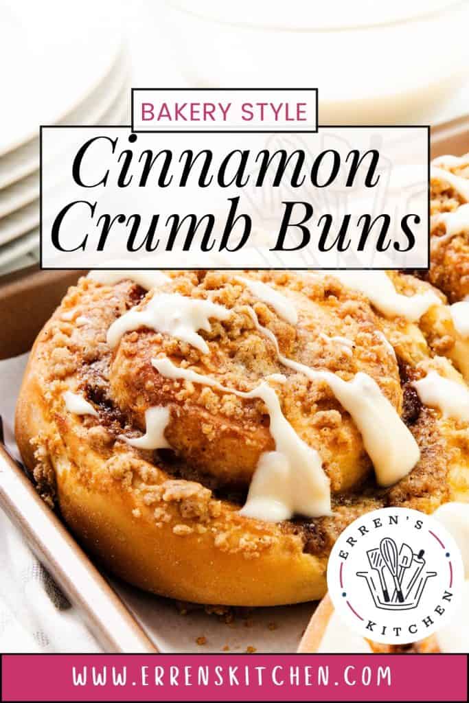 Close-up of irresistible Cinnamon Crumb Buns topped with sweet icing, resting in a baking dish. Text reads “Bakery Style Cinnamon Crumb Buns” and “Erren’s Kitchen,” with www.errenskitchen.com at the bottom.