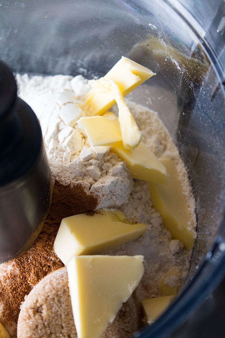 flour, sugar, brown sugar and butter in a bowl 
