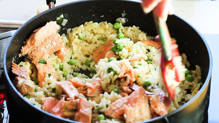 The Salmon added to the Risotto in the pan