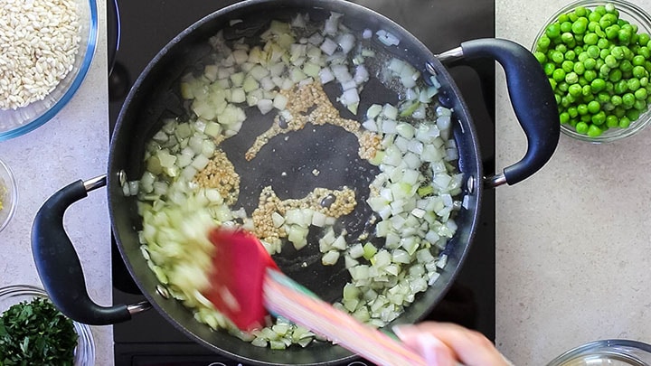 Chopped onions and thin sliced garlic sauteing in olive oil