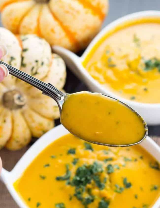 a spoonful of Winter Squash Soup with the bowl under it