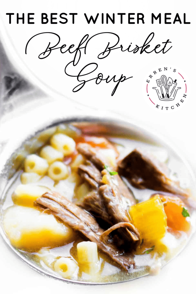 A laddle filled with slow cooker beef brisket soup with pieces of beef brisket, carrots, potatoes, celery, onion, pasta, and a beef broth. Fresh parsley sprinkled on top.