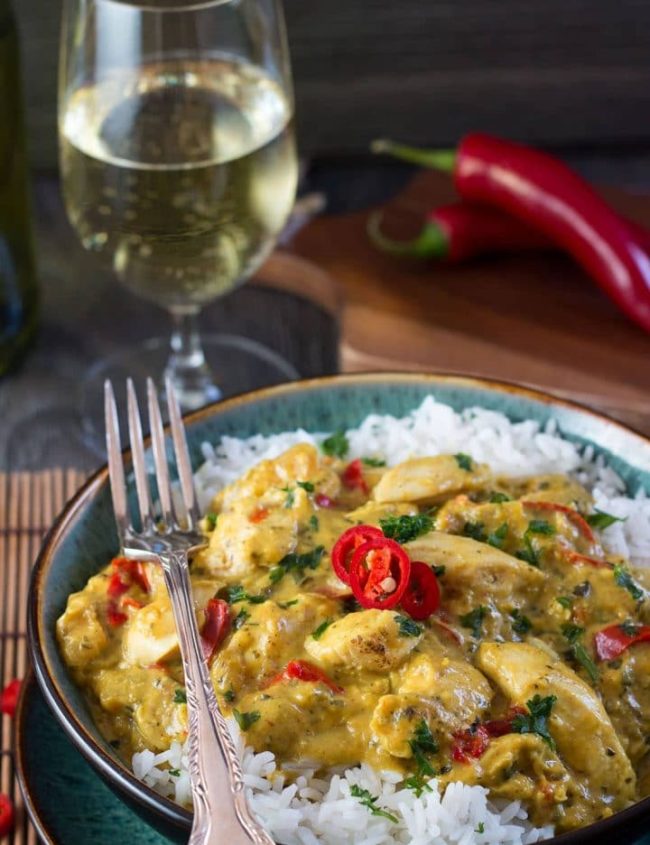 Thai Panang Chicken Curry on a bed of steamed rice and garnished with red chillies