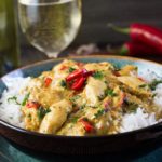 Thai Panang Chicken Curry on a bed of steamed rice and garnished with red chillies