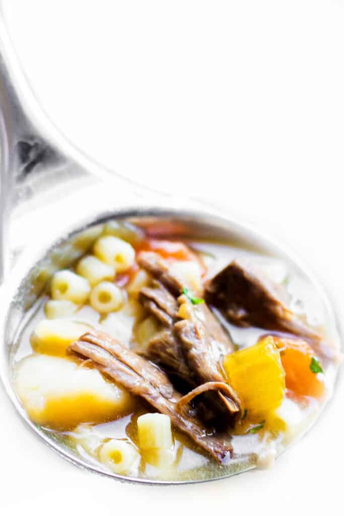 a ladle of Beef Brisket Soup