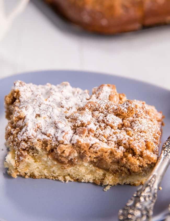 New Jersey Crumb Coffee Cake piled high with crumb topping and topped with powdered sugar