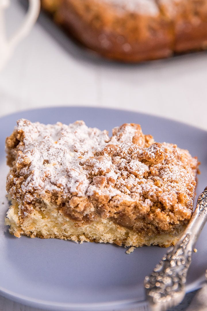 New Jersey Crumb Coffee Cake piled high with crumb topping and topped with powdered sugar