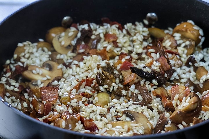 The recipe added to the bacon and mushroom mixture in the pan