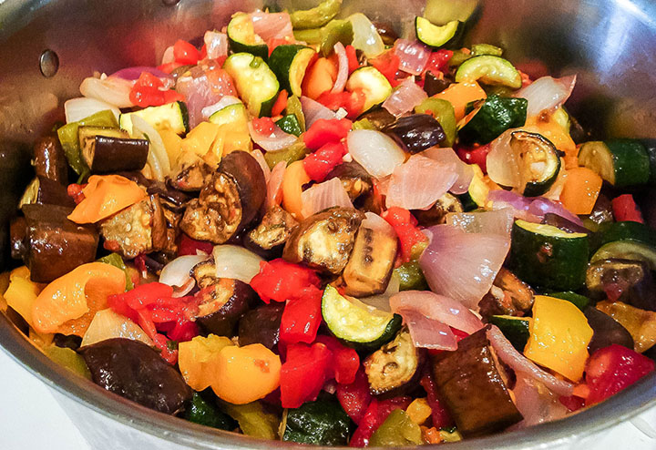 a pan with roasted vegetables cooked and ready to eat