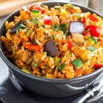 A bowl of Italian Style Rice bursting with roasted vegetables ready to eat