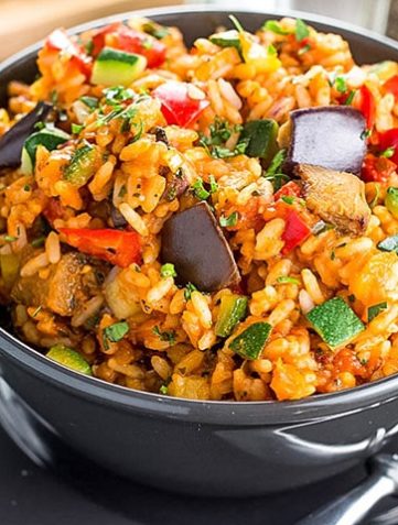 A bowl of Italian Style Rice bursting with roasted vegetables ready to eat