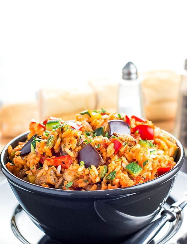 A bowl of Italian Style Rice bursting with roasted vegetables ready to eat