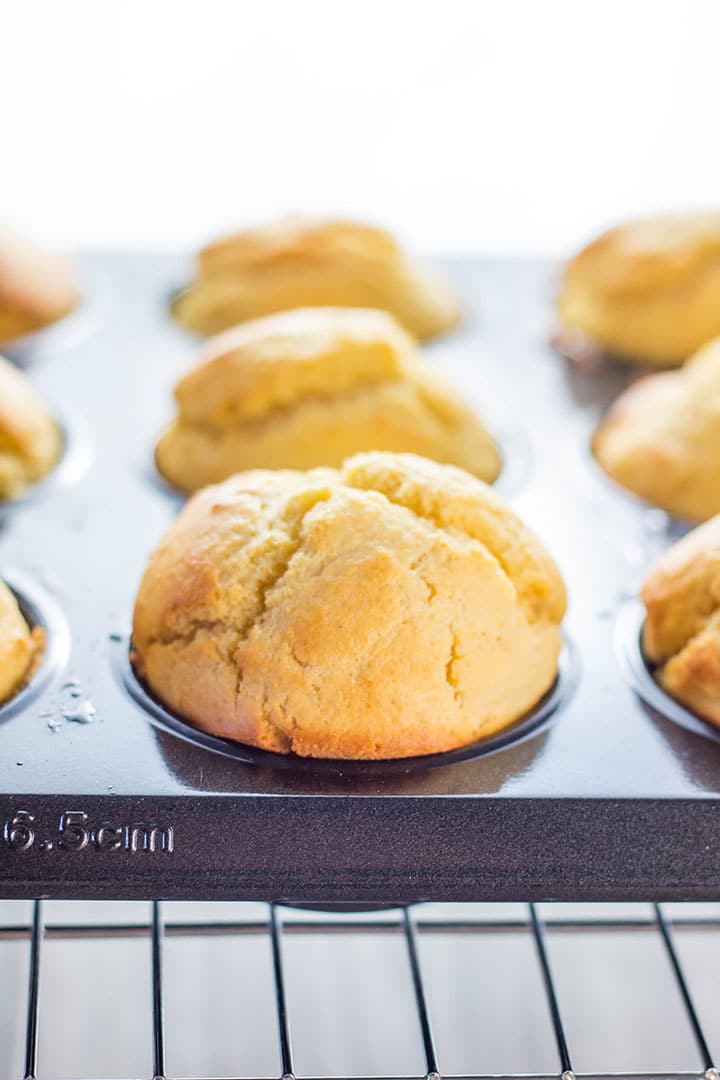 freshly baked corn muffins still in the pan