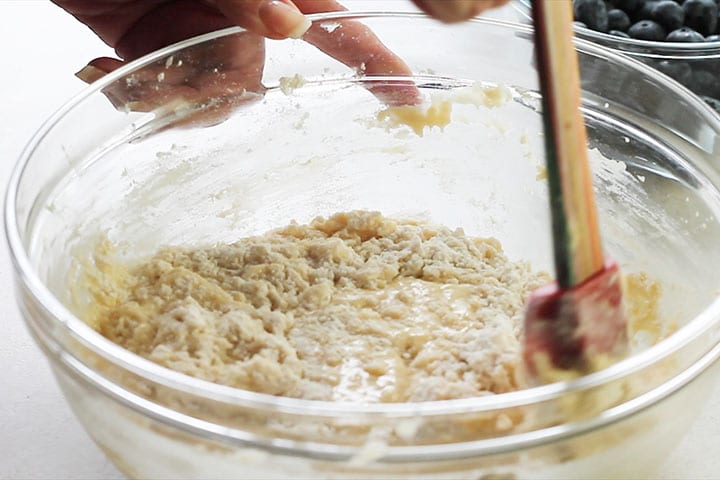 The dry ingredients being mixed in by hand into the batter 