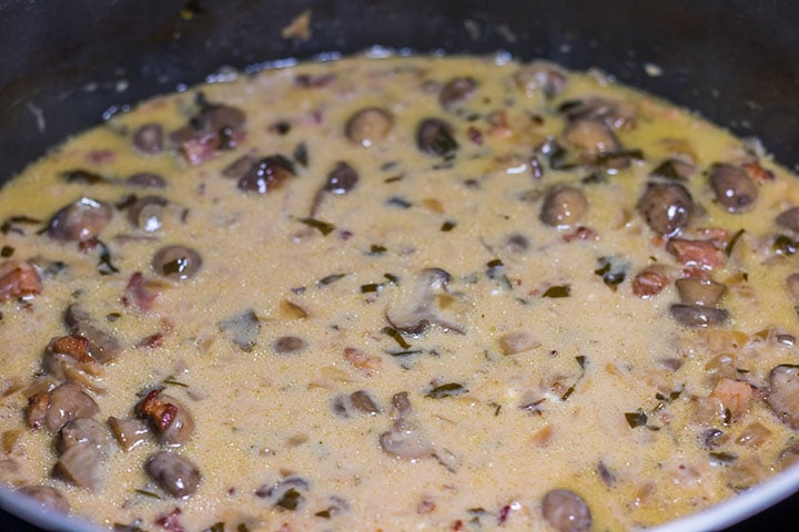 The sour cream stirred into the sauce,