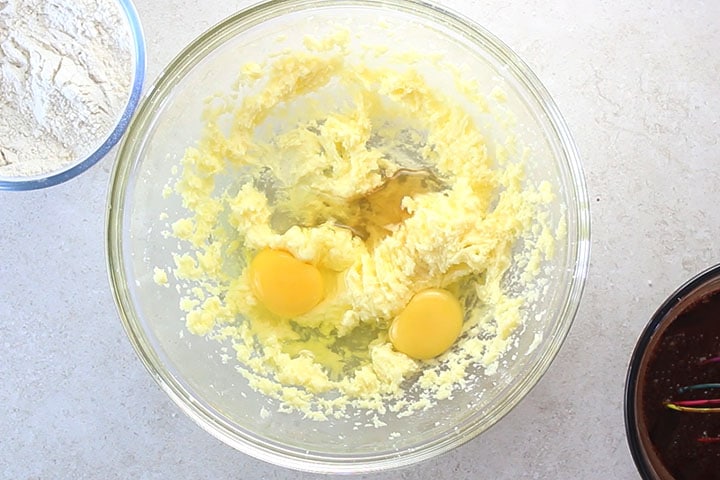 Eggs and vanilla added to the butter and sugar