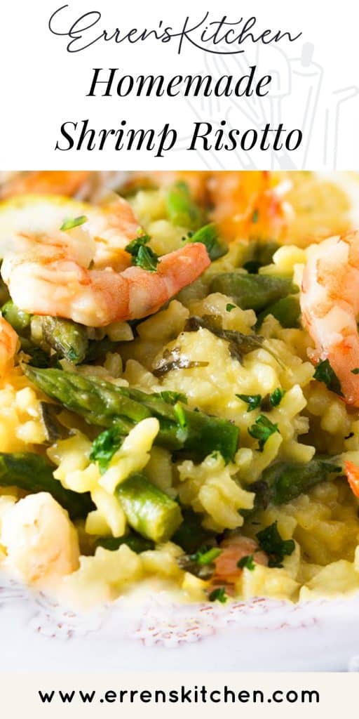 A dish piled high with yellow rice, asparagu and plump shrimp