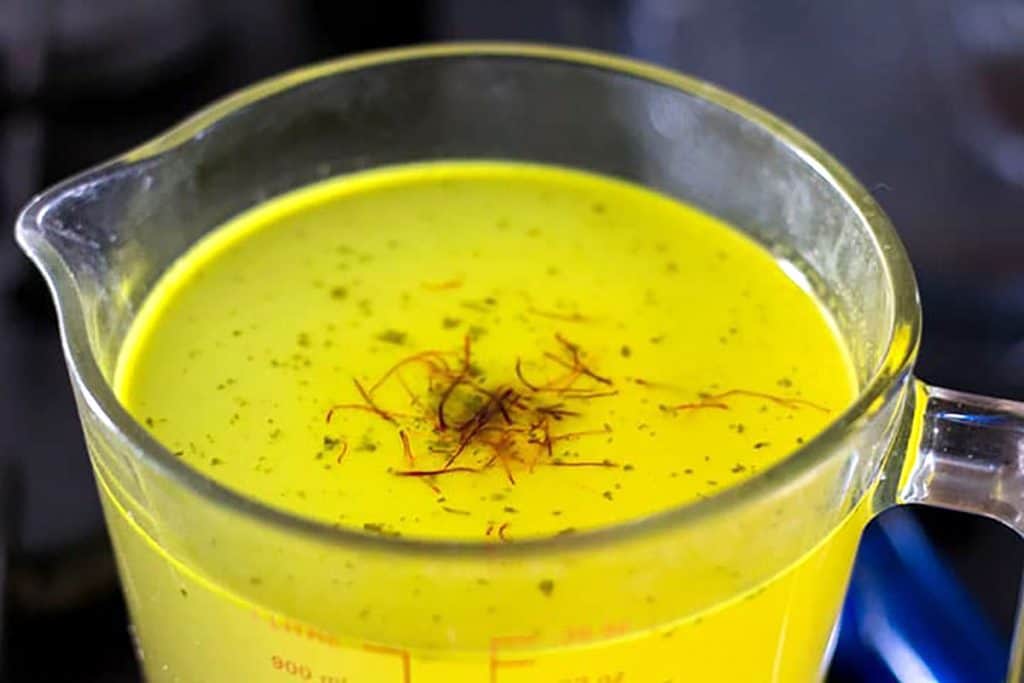 the saffron add to the stock in a glass jug