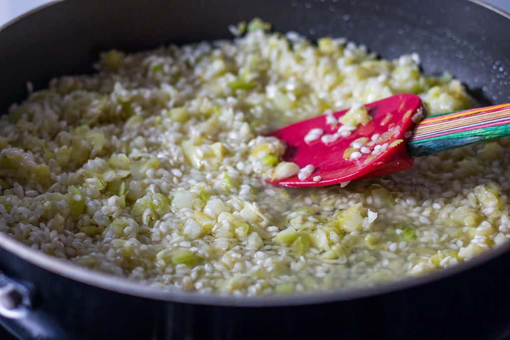 the wine added to the pan with the rice mixture