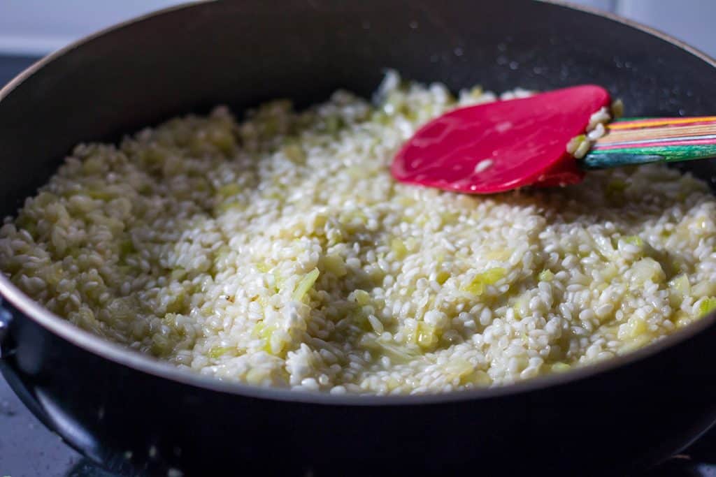 the rice in the pan that has absorbed the liquid