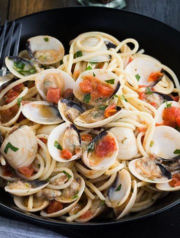 Spaghetti with Clam Sauce in a dish with a fork next to the plate
