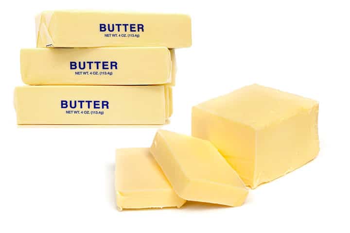 a photo of sticks of butter and a block of butter
