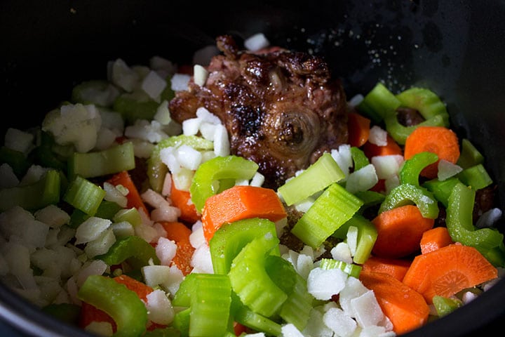 the vegetables added to the slow cooker with the oxtail 