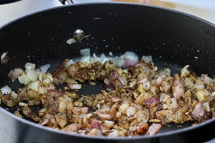 The onions cooking with the spices