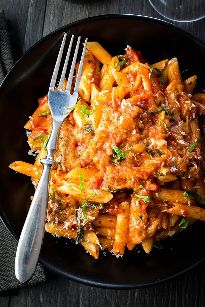 A big plate of Pasta Alla Norma {Pasta With Eggplant Sauce}with a fork laying next to it